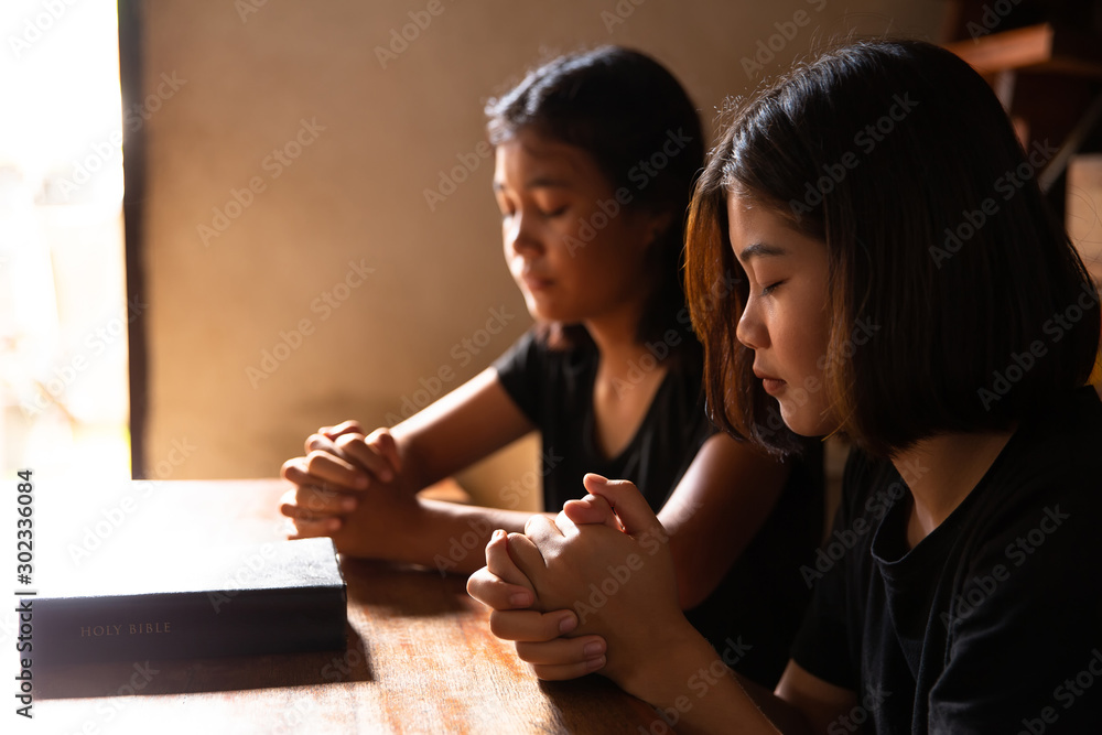 Wall mural christians are congregants join hands to pray.