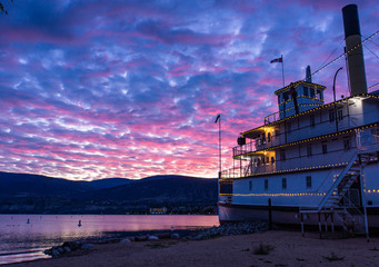 Historic white stern paddle wheeler on the shore of Okanagan Lake in Penticton, BC