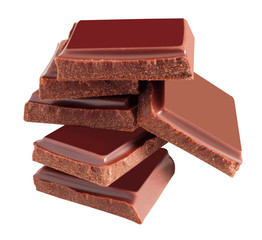 Delicious black chocolate shavings and pieces on white background, top view