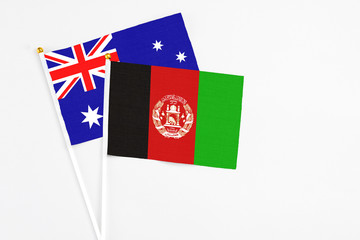 Afghanistan and Australia stick flags on white background. High quality fabric, miniature national...