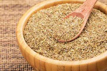 Wooden bowl fulled with delicious Italian Seasoning