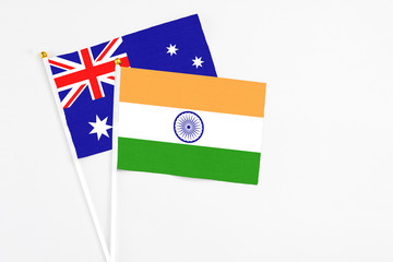 India and Australia stick flags on white background. High quality fabric, miniature national flag. Peaceful global concept.White floor for copy space.