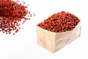 Organic achiote seeds in paper bag - Bixa Orellana