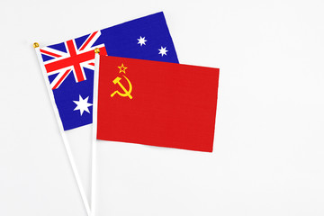 Soviet Union and Australia stick flags on white background. High quality fabric, miniature national flag. Peaceful global concept.White floor for copy space.