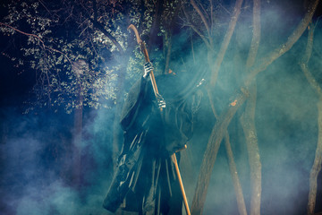 Portrait of grim reaper, the angel of death ( Azrael ) lurking through the woods at night...