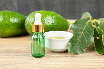 Cosmetic avocado oil in dropper bottle, mock up. Glass bottle. Avocado and olive oil mock up. Natural bio skin care cosmetic. Avocado Essential Oil  dropper mock up.