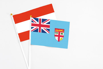 Fiji and Austria stick flags on white background. High quality fabric, miniature national flag....