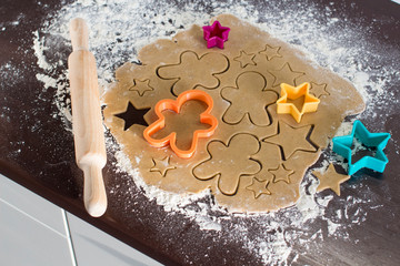 making christmas gingerbread cookies in a kitchen