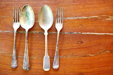Silver utensils on wooden floors