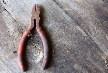 Old pliers on the old wooden floor