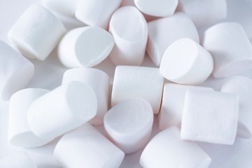 Fototapeta na wymiar white marshmallows on white background