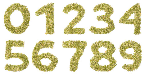 Arabic numerals   from freshly  green chopped peas  on a white isolated background. Food pattern...