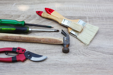 Tools placed on a wooden table.