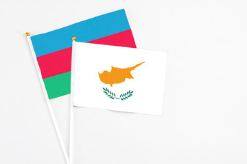 Cyprus and Azerbaijan stick flags on white background. High quality fabric, miniature national flag. Peaceful global concept.White floor for copy space.