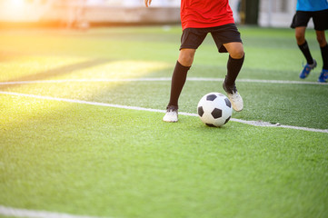 Boys playing football on the football practice field