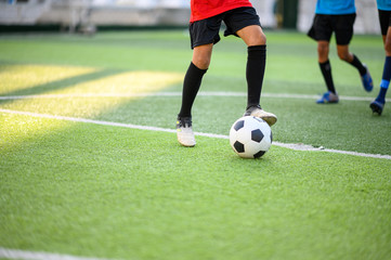 Boys playing football on the football practice field