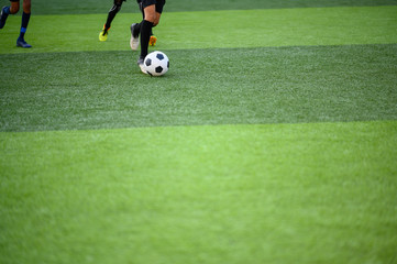 Boys playing football on the football practice field