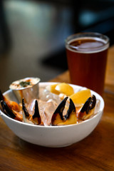 Fresh Stone Crab Claws with lemon and lime, sauce and ice in a dish in a restaurant