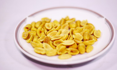 Fried peas on a plate, white background