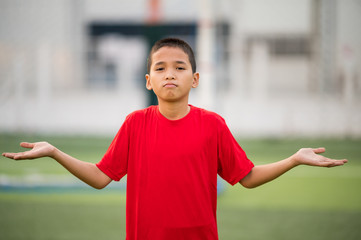 Boys playing football on the football practice field