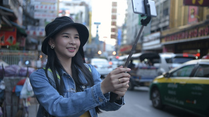 Travel concept. Beautiful girls are broadcasting live tourism in the city. 4k Resolution.