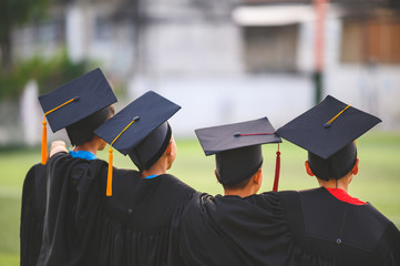 A group of boys are happy on their graduation day at school.
