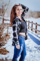 Beautiful young lady posing in a cold weather