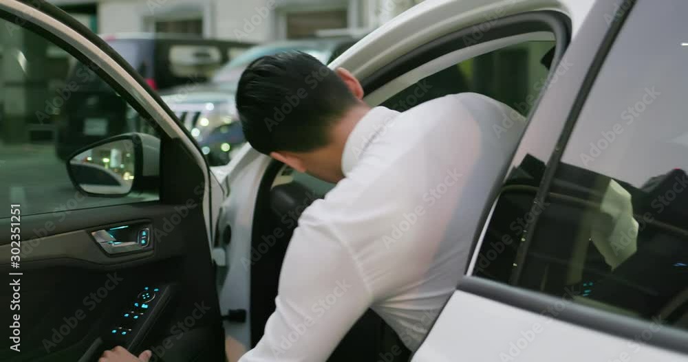 Poster man unlock door of car