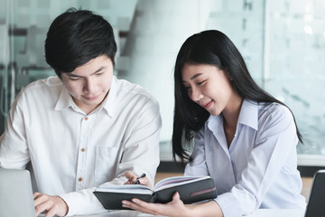 Consultation or Market data research concept, Adjustment of marketing strategies Female company owner discussing to a male market analyst To consult the company's marketing strategy.