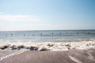 Fototapeta na wymiar Ocean wave crashing on a beach
