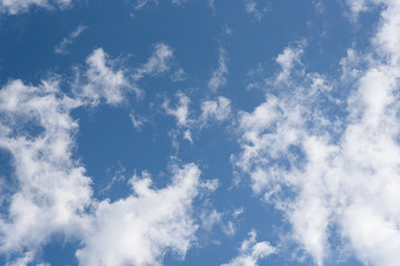 Blue sky and clean white clouds as a nature background