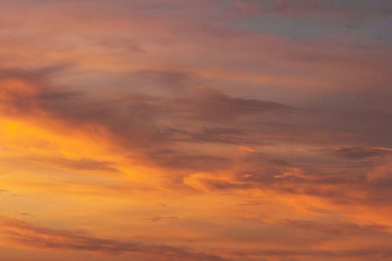 Colorful dramatic sky at sunset with pasted clouds