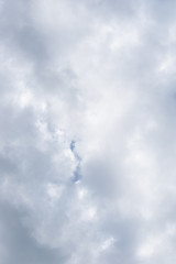 Cloud filled sky with a small peak of blue sky as a nature background