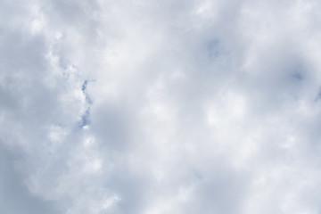 Cloud filled sky with a small peak of blue sky as a nature background