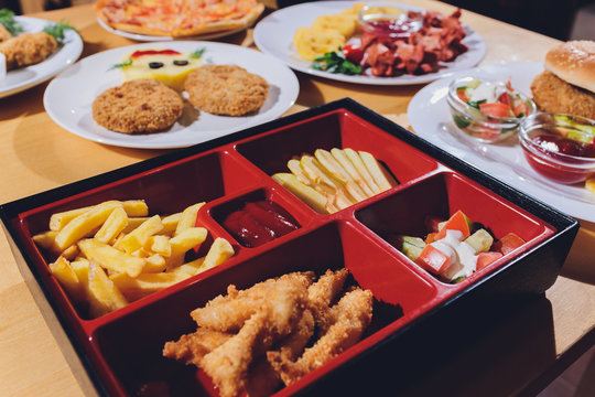Child food. Funny food. Plate with cutlets and mashed potatoes in the form of a monkey faces. Children's menu.