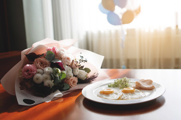 Food: fried eggs, ham and salad.