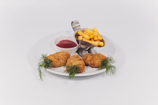 Child food. Funny food. Plate with cutlets and mashed potatoes in the form of a monkey faces. Children's menu.