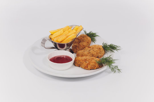 Child food. Funny food. Plate with cutlets and mashed potatoes in the form of a monkey faces. Children's menu.