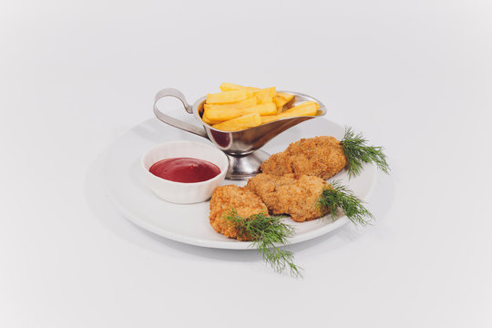 Child food. Funny food. Plate with cutlets and mashed potatoes in the form of a monkey faces. Children's menu.
