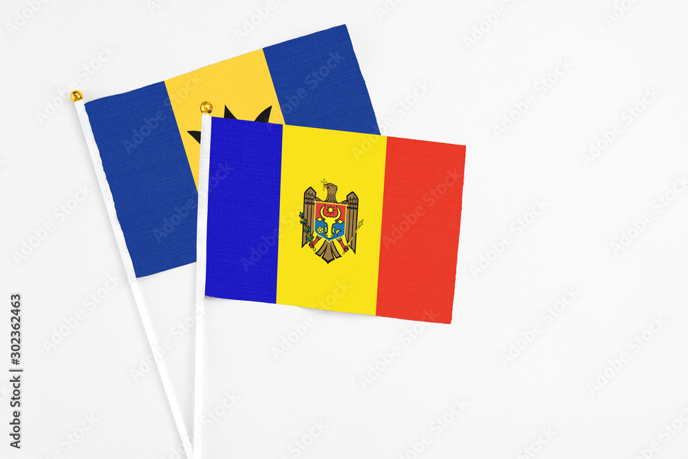 Wall mural Moldova and Barbados stick flags on white background. High quality fabric, miniature national flag. Peaceful global concept.White floor for copy space.