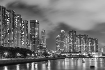 Seaside high rise residential building in Hong Kong city at night