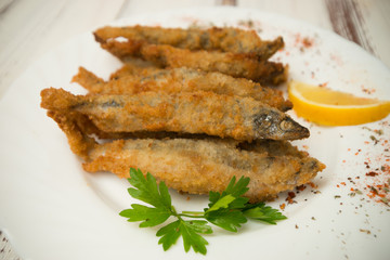 small breaded fish with spices - 302363213