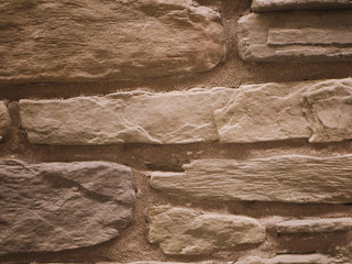 uneven stone facade close-up. Torn stone texture. Stone wall. Stonewall abstract background