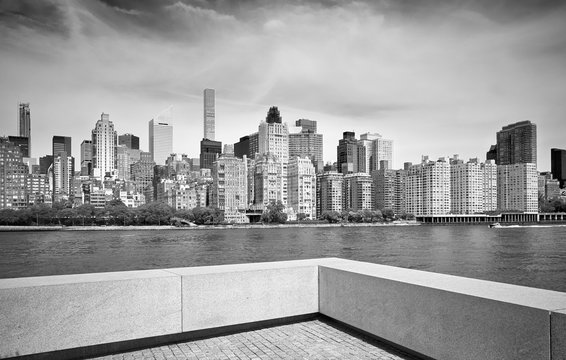 Black and white picture of Manhattan skyline seen from Roosevelt Island, New York City, USA.