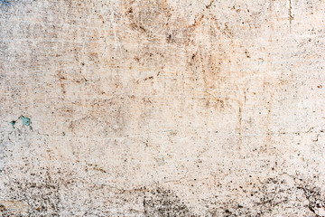 Texture of a concrete wall with cracks and scratches which can be used as a background