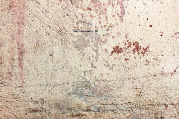 Texture of a concrete wall with cracks and scratches which can be used as a background