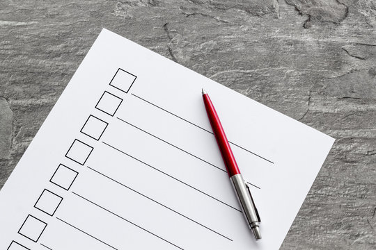 Empty check list ready to fill on grey background top view
