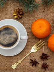 Cup of coffee, oranges, star anise and cinnamon