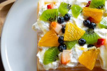 Waffle Fruity Kiwi Strawberry Blueberry Dessert. Fruity dessert food and drink category. Colorful Waffle Fruity. Close up shot. Top view.