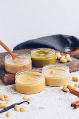 Fototapeta na wymiar Nuts and seeds butter in glass jars